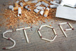 Stop smoking background with broken cigarettes and tobacco