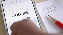 Unemployment And Looking For Work. Writing The Words Job Seeker On A Mobile Phone.