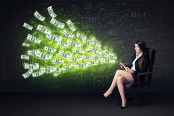 Poster - Businesswoman sitting in chair holding tablet with dollar bills