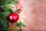 Fototapeta Londyn - Christmas tree with decor on bright background, closeup