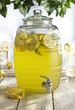 © Connect Images - Glass barrel with tap dispenser containing fresh lemonade drink