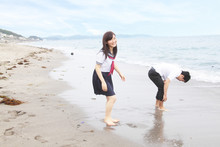 Young Couple Fooling Around On Beach