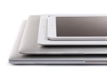 Wall Mural - Stack of electronic devices on a white desk