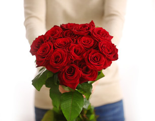 Poster - Woman with beautiful bouquet of red roses indoors