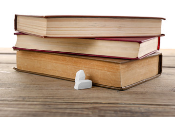 Canvas Print - Few books with chalk on table