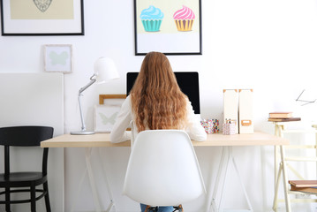 Wall Mural - Woman working with computer at home or at office