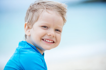 smiling little boy on the beach