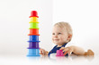 © Connect Images - Little boy playing with stacking cups
