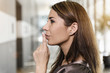 © Connect Images - Profile portrait of mid adult businesswoman with finger on lips