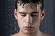 © Connect Images - Young man covered with water droplets