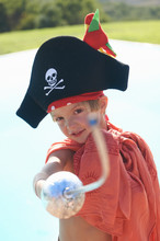 Portrait Of Boy In Pirates Hat, Pointing Toy Sword