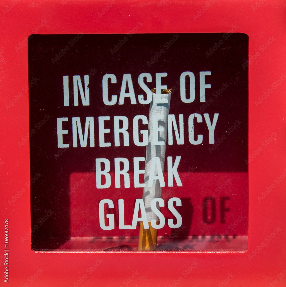 in case of emergency cigarette in case of emergency break glass and get cigarette Stock Photo
