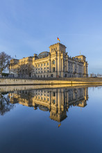 Reichstag With Reflection In River Spree