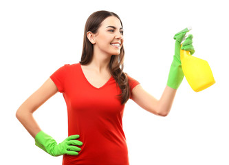 Wall Mural - Young woman holding detergent spray, isolated on white