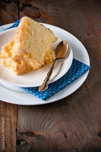 Fotografie, Obraz Chiffon cake with orange zest icing. Toned image, selective focus