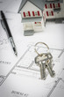 © Andy Dean - Model Home, Pencil and Keys Resting On House Plans