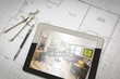 © Andy Dean - Computer Tablet Showing Room Illustration On House Plans, Pencil and Compass
