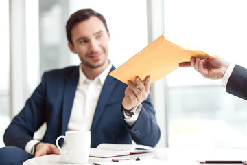 Sticker - Positive businessman sitting at the table 