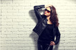 © MaxFrost - fashion model in sunglasses, black leather jacket, leather pants