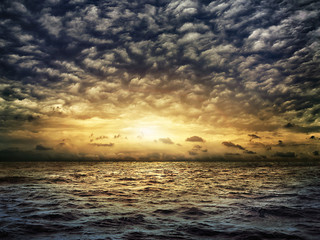 Wall Mural - dark stormy sea with a dramatic cloudy sky