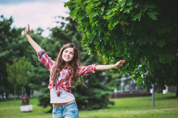 Wall Mural - young laughing girl in the park.