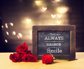 There is a always reason to smile message with roses