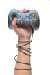 © stlee000 - hand holding game controller and tied up with cables