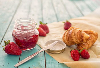 Strawberry jam and croissants