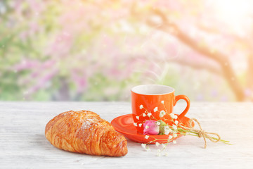 cup of coffee with croissant