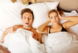 © Piotr Marcinski - Couple in bed,man snoring woman can't sleep