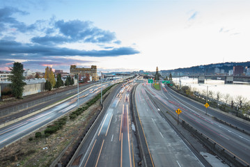 traffic on road with cityscape and skyline of portland