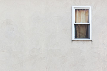 Empty wall with small window.