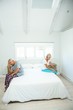 © WavebreakMediaMicro - Senior man and woman sitting on bed