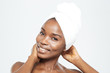 © Drobot Dean - Smiling afro american woman with towel on head