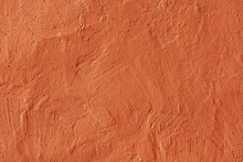 Abstract Orange Plaster Wall Texture.