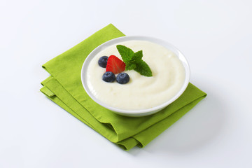 Wall Mural - Smooth semolina porridge with fresh fruit