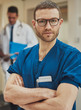 © Flamingo Images - Serious surgeon looking intently at the camera