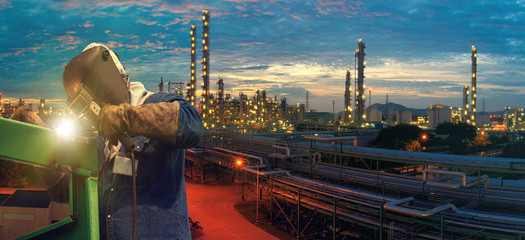 Industrial Worker at the factory welding