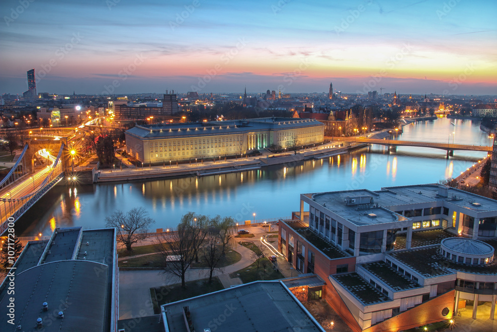Obraz na płótnie WROCLAW, POLAND - APRIL 02, 2016: Aerial view of Wroclaw. Illuminated city skyline during a beautiful sunset, April 02, 2016 in Wroclaw, Poland. w salonie