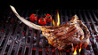 Single tomahawk rib steak on hot grill