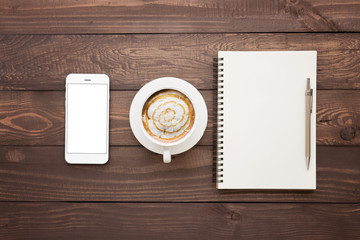 phone coffee and book blank on wood table top view