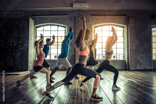 Group workout in a hall. Workout in a fitness gym