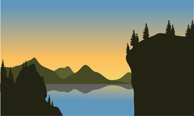 Silhouette of cliff on the lake