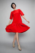 © EVGENY FREEONE - Brunette woman in red dress