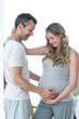 © WavebreakMediaMicro - Man holding pregnant womans stomach