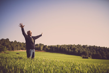 Old man happy in the field