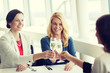 © Syda Productions - happy women drinking champagne at restaurant