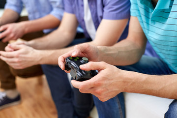 Poster - close up of friends playing video games at home