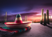 Mexican Hat "sombrero" On A "serape" In A Mexican Desert At Twil