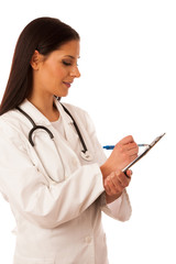 Woman doctor with stethoscope around neck writing diagnose on cl